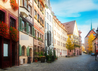 Fototapeta na wymiar Historic street in old town of Nuremberg, Germany, retro toned