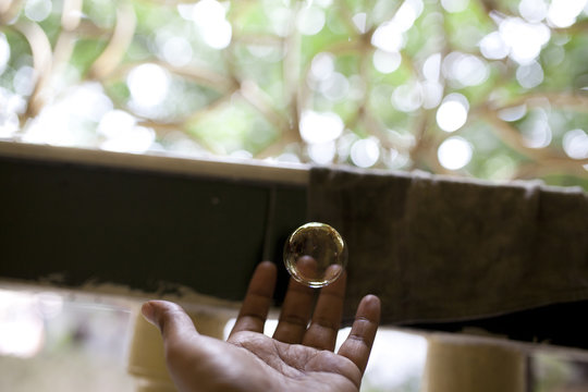 A man trying to hold a bubble