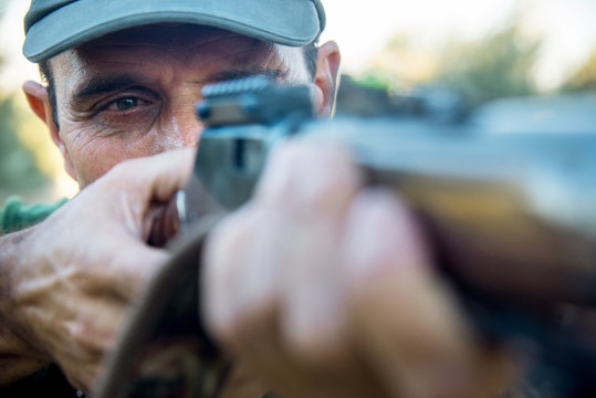 Hunter with a rifle in the countryside, Spain