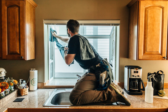 Window Washer On Top Of Kitchen Counter Cleaning Interior Of Win