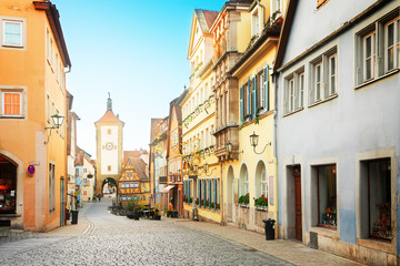 Fototapeta na wymiar old street, Plonlein and city tower of Rothenburg ob der Tauber, Germany, retro toned