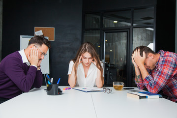 Brainstorming in difficult business situation office workers colleagues