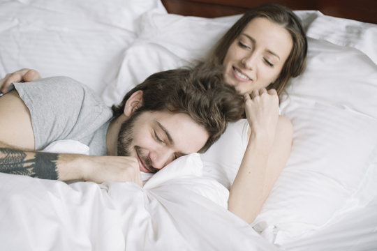 Couple sleeping hugging on pillow