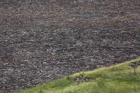 Stone wall of a mountain dam
