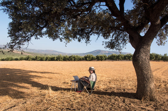 Painter painting a landscape, Andalusia