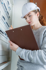 woman measuring electrical current