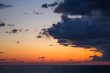 Sunset seascape with dramatic sky and colorful clouds