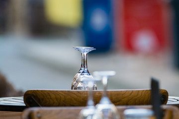 Empty wine glasses on the table served for lunch, dinner in cafe, restaurant outside or on terrase