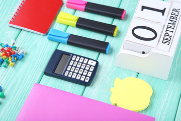 School supplies on mint wooden table