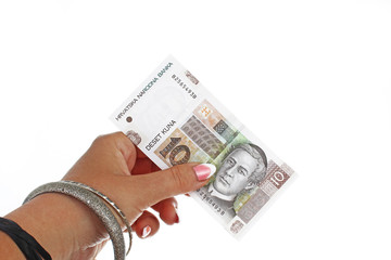 Woman hand holding  croatian money Kuna on isolated white cutout background. Studio photo with studio lighting easy to use for every concept.