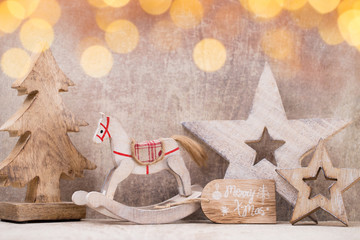 Christmas tree decorations on a wooden background. With bokeh ornaments.