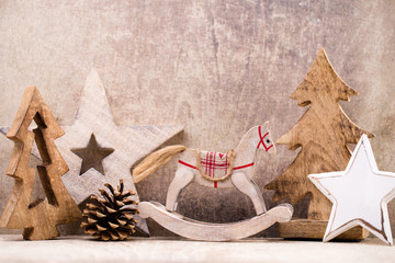 Christmas tree decorations on a wooden background. With bokeh ornaments.