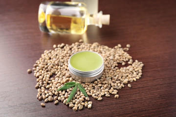 Composition with hemp lotion on wooden background