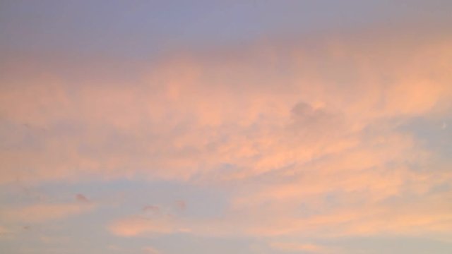 Skyscape or cloudscape. Evening sky with fluffy clouds moving across it. Weather. Time lapse. Full HD