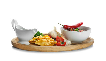 Chili con carne in bowl with chips, sauce and vegetables, isolated on white