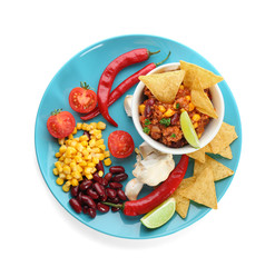 Chili con carne in bowl with chips and vegetables, isolated on white