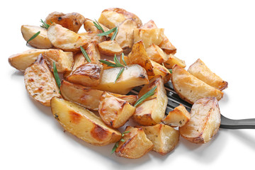 Delicious rosemary potatoes with spatula, isolated on white