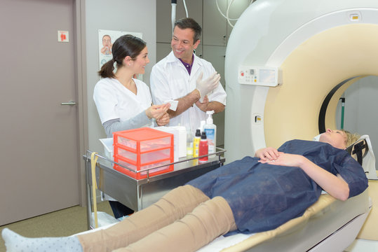doctor giving instructions to technician for carrying out mri scan