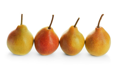 Delicious ripe pears on white background