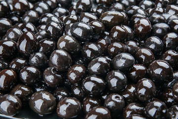 Canned black olives as background