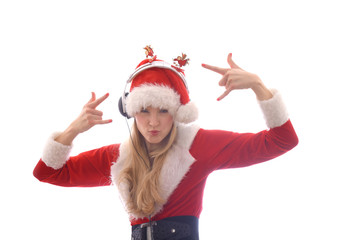 A young girl dresses up as Santa Claus and wants to hear Christmas music. She wears headphones on...