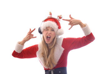 Obraz premium A young girl dresses up as Santa Claus and wants to hear Christmas music. She wears headphones on her head and shouts and yells out the songs she hears.