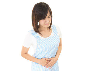 Fototapeta premium 腹痛を訴える女性