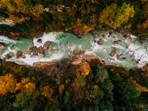Aerial view of river and road on autumn