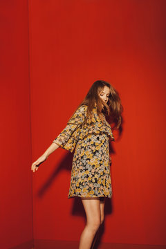 young blond woman with flower pattern dress