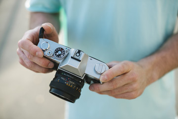 Photographer holding an analog camera