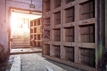 Big rusty heavy steel hermetic doors in the abandoned Soviet bomb shelter