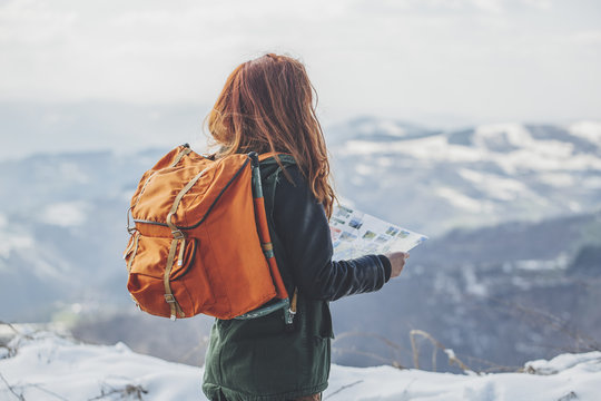 Woman Hiking With an Orange Backpack