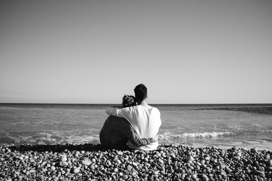 Couple embracing on the beach