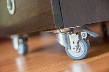 Standing small metal furniture wheel