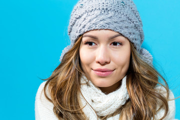 Happy young woman in winter clothes in night