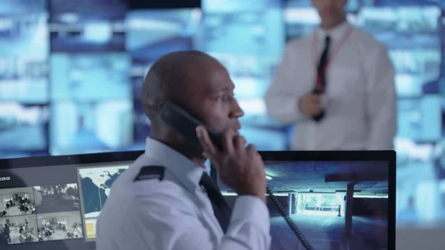  Surveillance team watching CCTV screens & reacting to suspicious activity