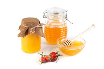 Honey in jar on a white background