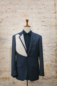 Expensive Blue Pinstripe Suit on Hanger Stand