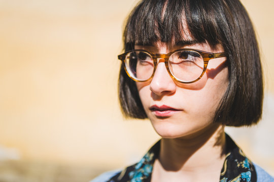 Nerdy Young Woman Posing Serious