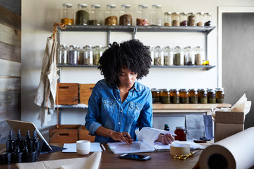 Millennial African American Woman businesswoman in her skincare studio