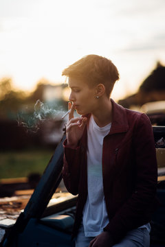Young attractive woman smoking a cigarette