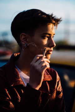 Young attractive woman smoking a cigarette