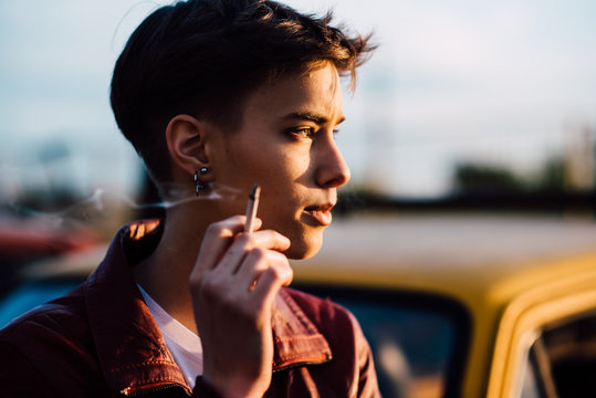 Young attractive woman smoking a cigarette
