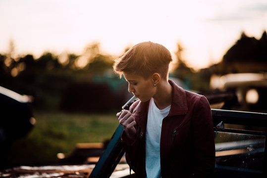 Young attractive woman smoking a cigarette