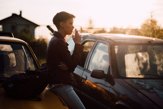 Young attractive woman smoking a cigarette