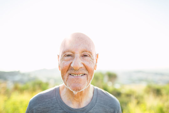 Portrait of a smiling senior man in the mountain.