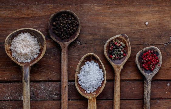 Different salt and peppercorn in Wooden Spoons
