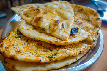 Many homemade small tortillas for breakfast, in silver foil, Jaipur city in India