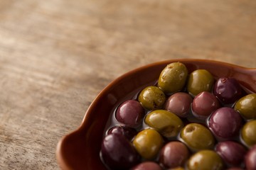 High angle view of olives with oil in container