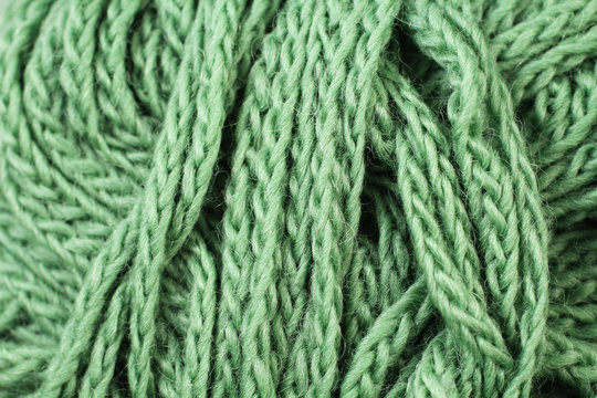 A super close up image of forest green yarn
